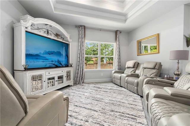 living room featuring ornamental molding and a tray ceiling