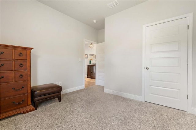 unfurnished room featuring light carpet