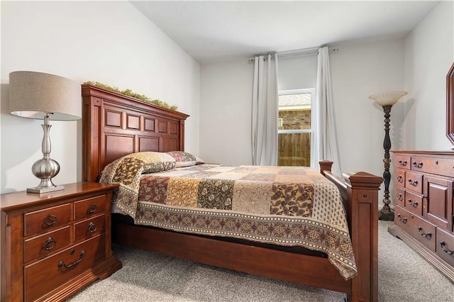 bedroom featuring light colored carpet