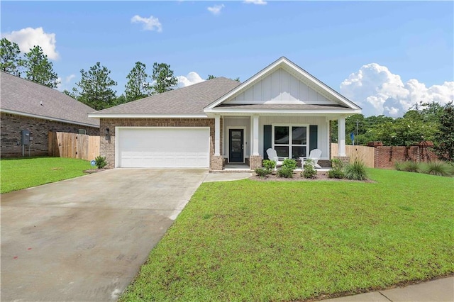 craftsman-style house featuring a garage, a porch, and a front lawn