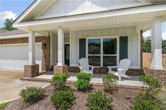 exterior space featuring a porch and a garage