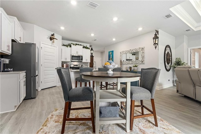 dining room with light wood-type flooring