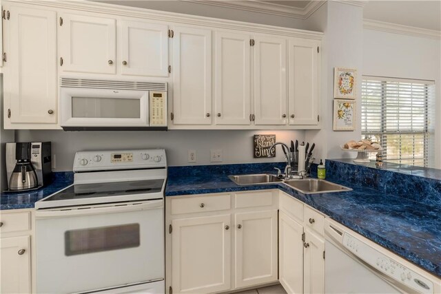 50 Forney Johnston Dr Unit 7A, Dauphin Island, AL 36528 - kitchen with a sink, white appliances, crown molding, and white cabinetry