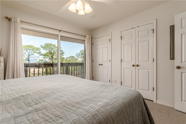 50 Forney Johnston Dr Unit 7A, Dauphin Island, AL 36528 - carpeted bedroom featuring baseboards, two closets, ceiling fan, and access to outside