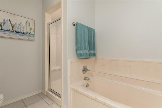 50 Forney Johnston Dr Unit 7A, Dauphin Island, AL 36528 - full bathroom with a garden tub, toilet, a shower stall, tile patterned flooring, and baseboards