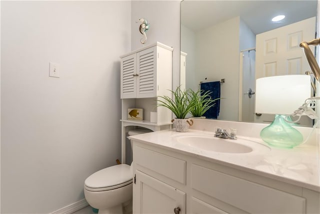 50 Forney Johnston Dr Unit 7A, Dauphin Island, AL 36528 - bathroom featuring baseboards, toilet, and vanity