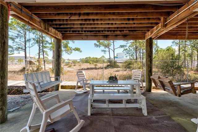 50 Forney Johnston Dr Unit 7A, Dauphin Island, AL 36528 - view of patio featuring outdoor dining area and fence
