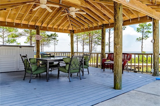 50 Forney Johnston Dr Unit 7A, Dauphin Island, AL 36528 - wooden deck with outdoor dining space, a gazebo, and a ceiling fan