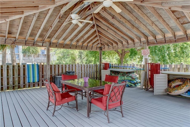 50 Forney Johnston Dr Unit 7A, Dauphin Island, AL 36528 - wooden terrace featuring outdoor dining area, fence, and ceiling fan