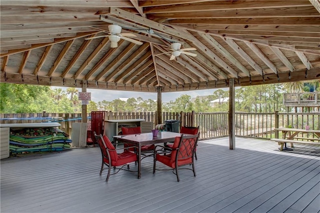 50 Forney Johnston Dr Unit 7A, Dauphin Island, AL 36528 - wooden deck featuring outdoor dining space, a gazebo, and a ceiling fan