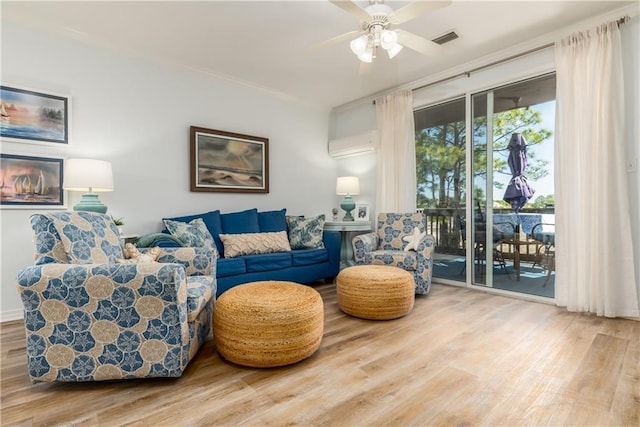 50 Forney Johnston Dr Unit 7A, Dauphin Island, AL 36528 - living area with visible vents, ornamental molding, a ceiling fan, wood finished floors, and a wall unit AC
