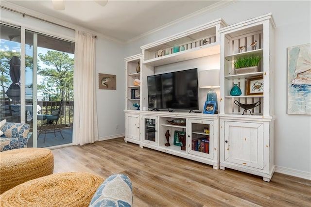 50 Forney Johnston Dr Unit 7A, Dauphin Island, AL 36528 - living room featuring wood finished floors, a ceiling fan, baseboards, and ornamental molding