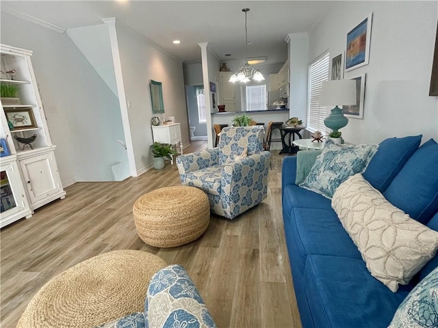 50 Forney Johnston Dr Unit 7A, Dauphin Island, AL 36528 - living area with crown molding, baseboards, recessed lighting, wood finished floors, and a notable chandelier