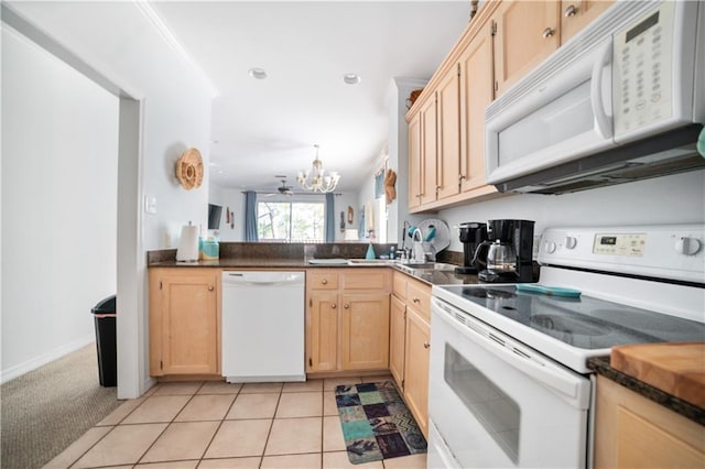 kitchen featuring kitchen peninsula, white appliances, light brown cabinets, light carpet, and ceiling fan with notable chandelier