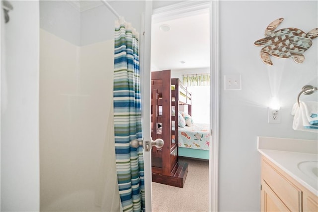 bathroom with a shower with curtain and vanity