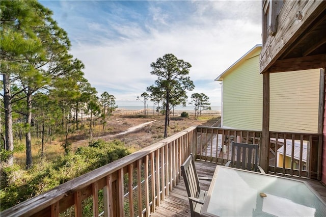 wooden deck with a rural view