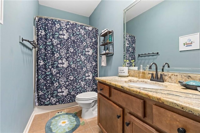 bathroom with vanity, tile patterned floors, and toilet