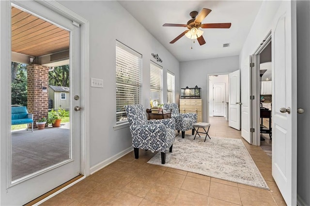 sitting room featuring light tile patterned floors and ceiling fan