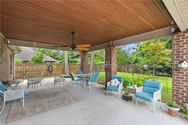 view of patio featuring ceiling fan