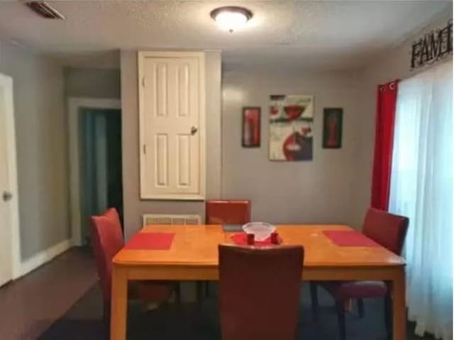 361 Fredonia St, Mobile, AL 36607 - dining room with visible vents and a textured ceiling