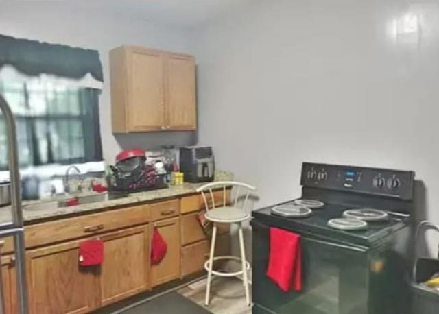 361 Fredonia St, Mobile, AL 36607 - kitchen featuring a sink, light countertops, and black / electric stove