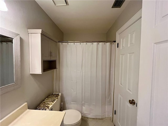 bathroom with radiator, toilet, and vanity