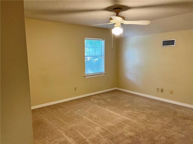 unfurnished room with carpet floors, a textured ceiling, and ceiling fan