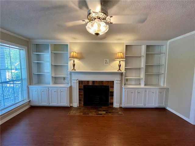 unfurnished living room with a textured ceiling, dark hardwood / wood-style floors, and ornamental molding