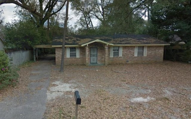 ranch-style house with a carport