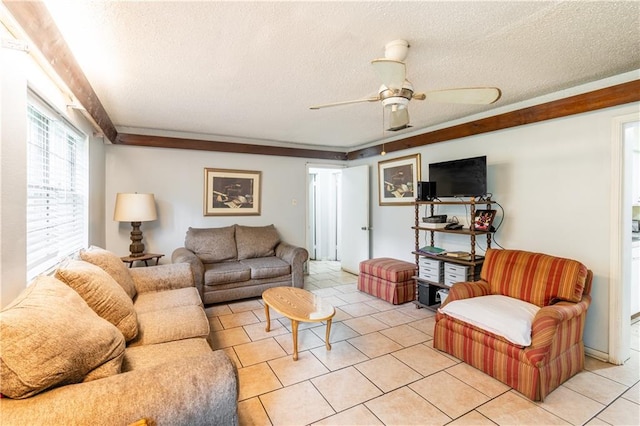 living room with ceiling fan, a textured ceiling, and light tile patterned floors