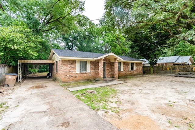 view of front facade with a carport