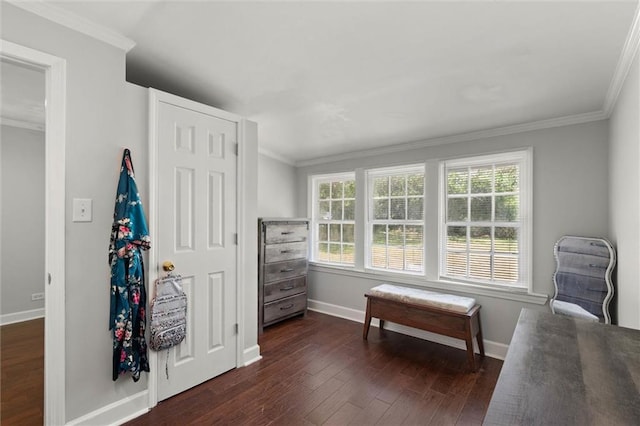 sitting room featuring crown molding, baseboards, and dark wood finished floors