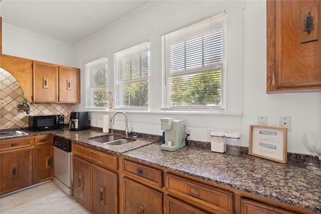 kitchen with black microwave, dishwasher, plenty of natural light, and a sink