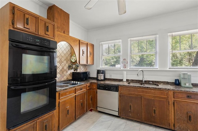 kitchen with a sink, brown cabinets, black appliances, and crown molding