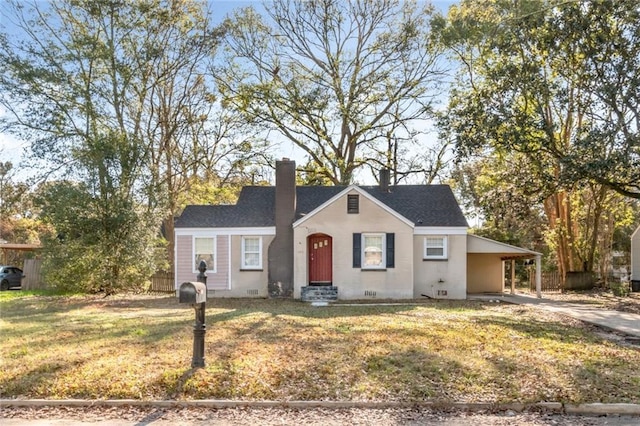 view of front of property with concrete driveway, crawl space, a carport, a chimney, and a front yard