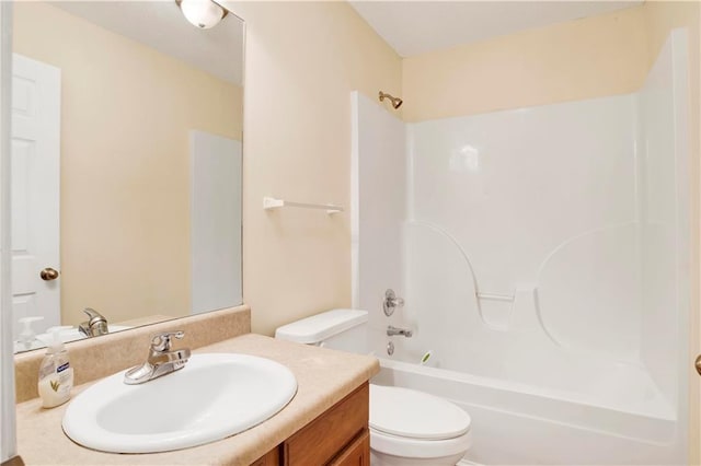 full bathroom with vanity, tub / shower combination, and toilet