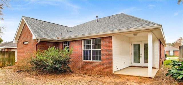 back of property featuring a patio area and french doors