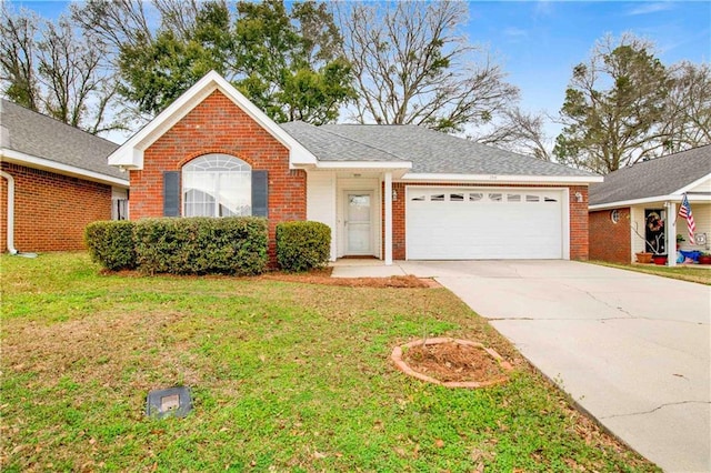 ranch-style home featuring a garage and a front lawn