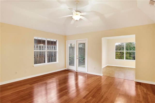 spare room with hardwood / wood-style floors and ceiling fan