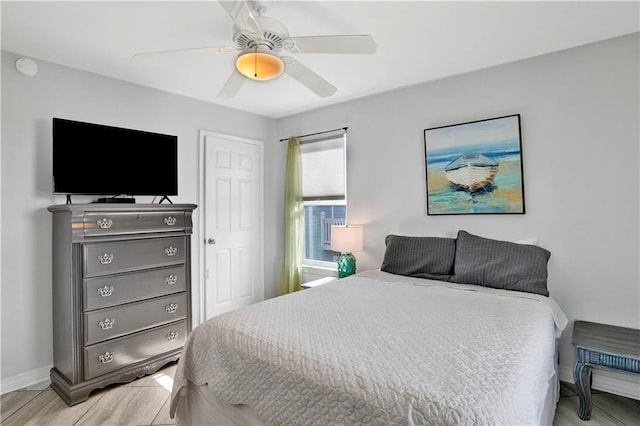 bedroom featuring baseboards and a ceiling fan