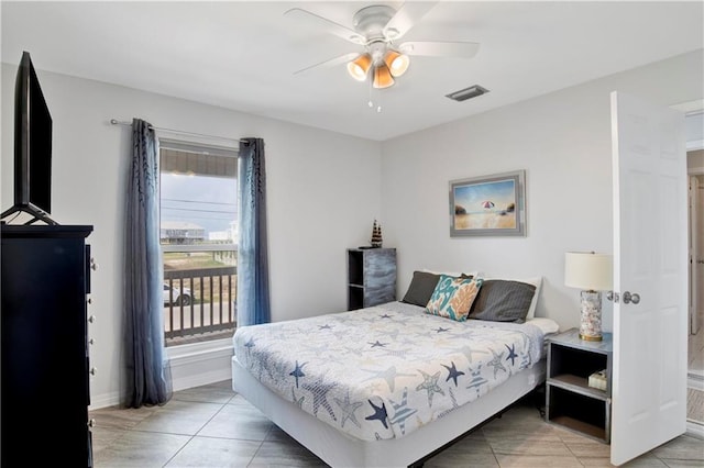 bedroom with light tile patterned floors, visible vents, baseboards, and ceiling fan