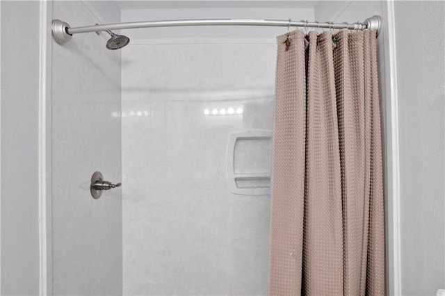 bathroom featuring curtained shower