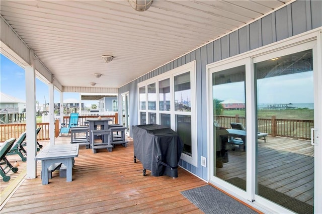 wooden terrace featuring grilling area