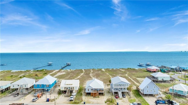 drone / aerial view featuring a residential view and a water view