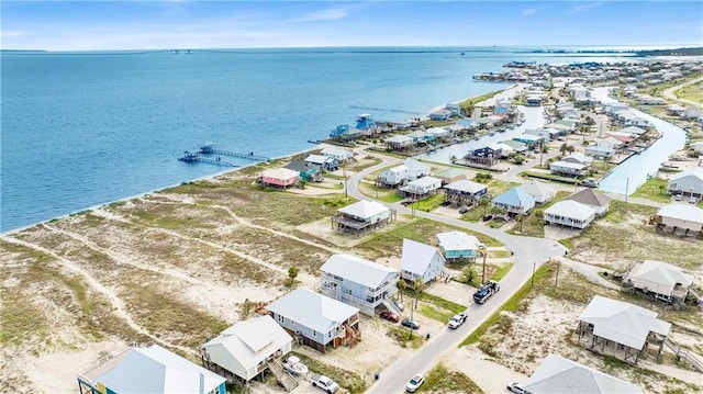 aerial view featuring a residential view and a water view