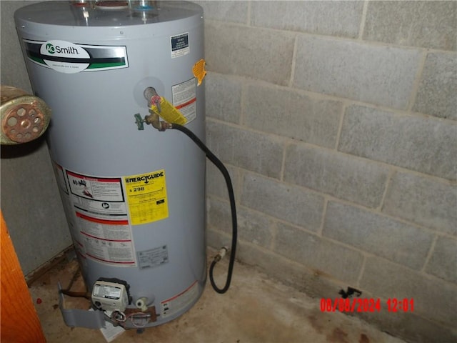 utility room with gas water heater