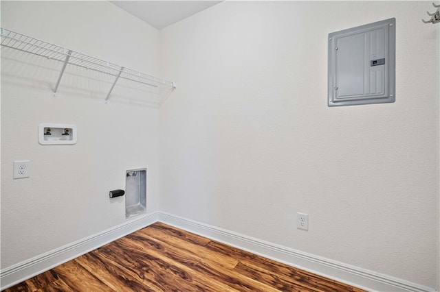 clothes washing area with washer hookup, hardwood / wood-style flooring, and electric panel