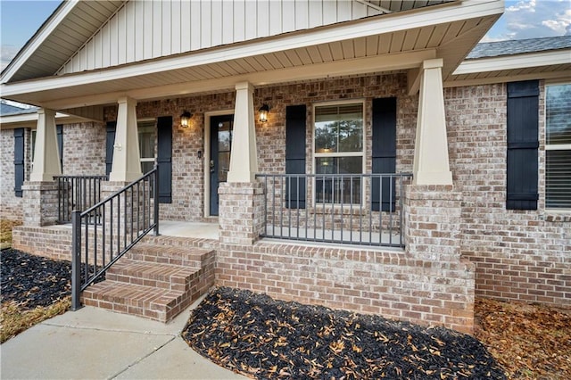 doorway to property with covered porch