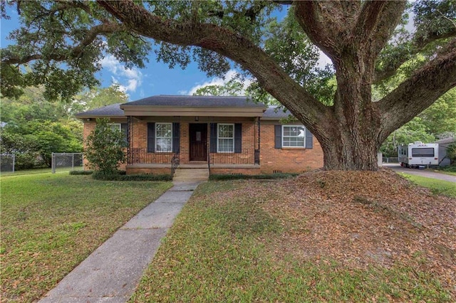 2774 Grafhill Dr N, Mobile, AL 36606 - view of front facade featuring fence, a porch, a front lawn, and brick siding