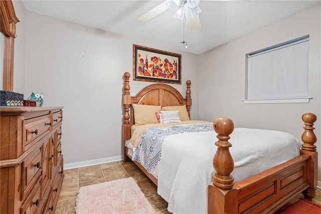 tiled bedroom featuring ceiling fan